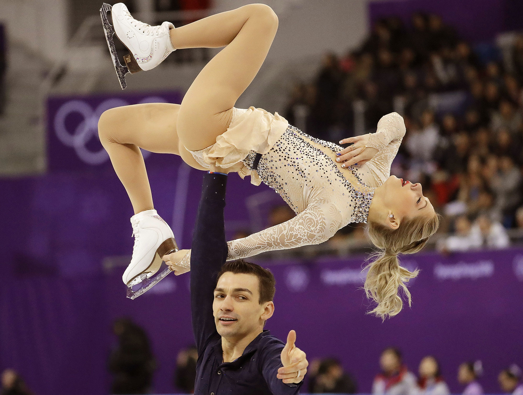 Chris Knierim holds wife Alexa Scimeca Knierim during their short program in the figure skating team event at the 2018 Winter Olympics