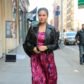 chrissy teigen pregnant baby bump pink dress leather jacket