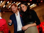 Britain's Prince Harry and his fiancee US actress Meghan Markle greet a well-wisher as they tour the Terrence Higgins Trust World AIDS Day charity fair at Nottingham Contemporary in Nottingham.