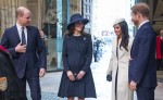 Meghan Markle, wearing a white Stephen Jones beret and a matching Amanda Wakeley crombie coat, attends the Commonwealth Day service at Westminster Abbey with her fiance Prince Harry