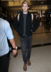 Joe Alwyn touches down in Los Angeles from London