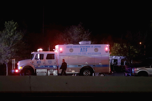 ROUND ROCK, TX - MARCH 21:  Law enforcement officials investigate at the location where the suspected package bomber was killed in suburban Austin on March 21, 2018 in Round Rock, Texas. The 24-year-old suspect blew himself up inside his car as police approached the vehicle. A massive search had been underway by local and federal law enforcement officials in Austin and the surrounding area after several package bombs had detonated in recent weeks, killing two people and injuring several others. 