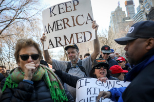 NEW YORK, NY - MARCH 24: Supporters of President Donald Trump (wearing hats) counter-protest during the March For Our Lives, March 24, 2018 in New York City. Thousands of demonstrators, including students, teachers and parents are gathering in Washington, New York City and other cities across the country for an anti-gun violence rally organized by survivors of the Marjory Stoneman Douglas High School school shooting on February 14 that left 17 dead. More than 800 related events are taking place around the world to call for legislative action to address school safety and gun violence.