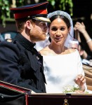 Newlyweds Prince Harry & Megan Markle travel down Windsor street after the Royal Wedding