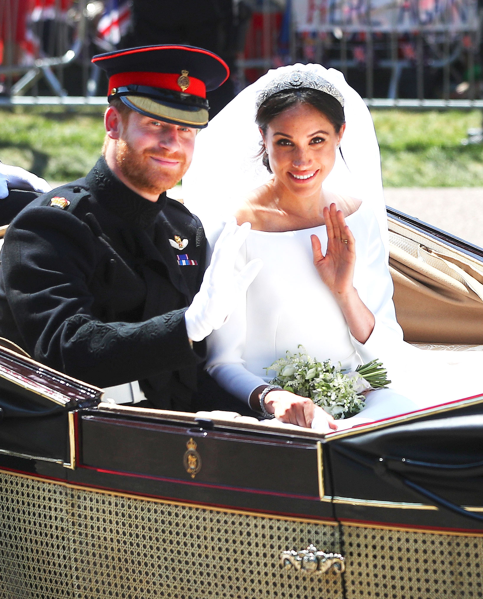 Prince Harry and Meghan Markle greet crowds outside of Windsor Castle following their wedding ceremony