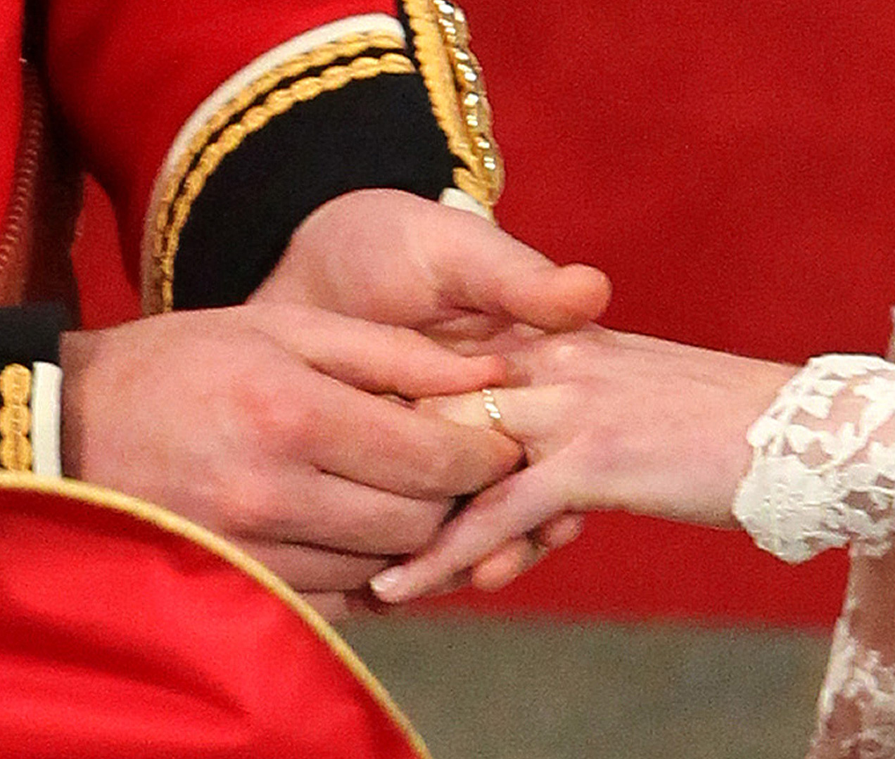 Prince William putting Kate Middleton's wedding band on in 2011